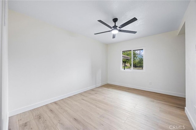 unfurnished room featuring ceiling fan and light wood-type flooring