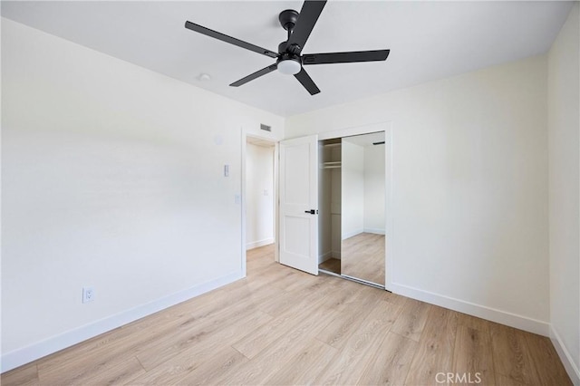 unfurnished bedroom featuring a closet, ceiling fan, and light hardwood / wood-style flooring