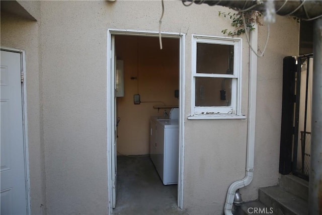 doorway to property featuring separate washer and dryer