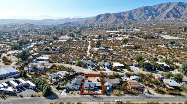 birds eye view of property featuring a mountain view