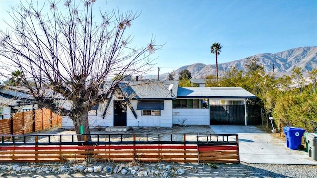 exterior space with a carport and a mountain view