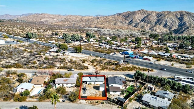 drone / aerial view featuring a mountain view