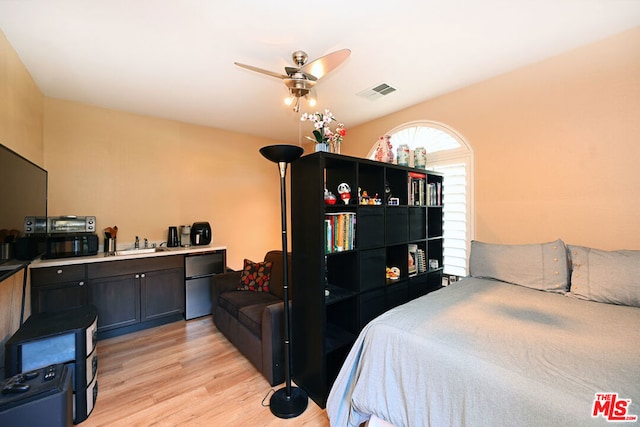 bedroom featuring ceiling fan and light wood-type flooring