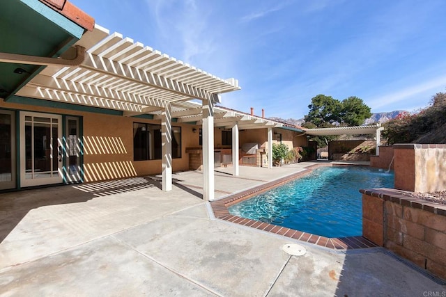 view of pool with a pergola, a patio area, and pool water feature