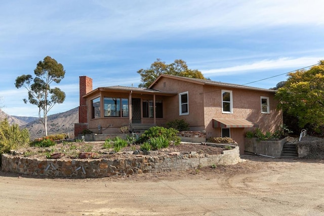 view of front of property featuring a mountain view