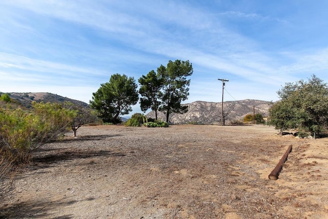 exterior space featuring a rural view and a mountain view