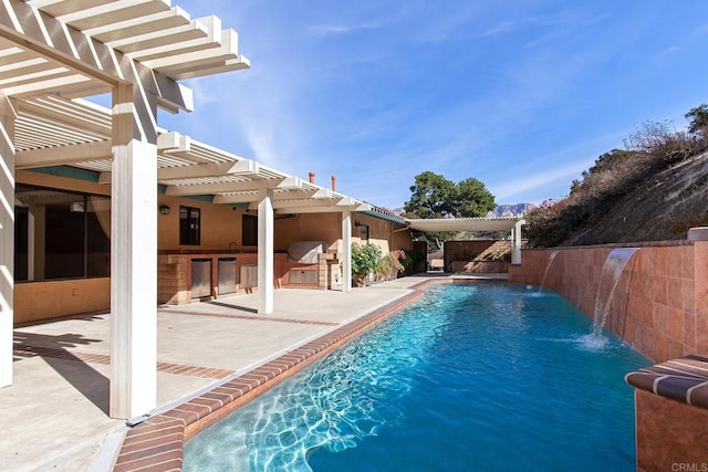 view of pool with area for grilling, a patio, a pergola, and pool water feature