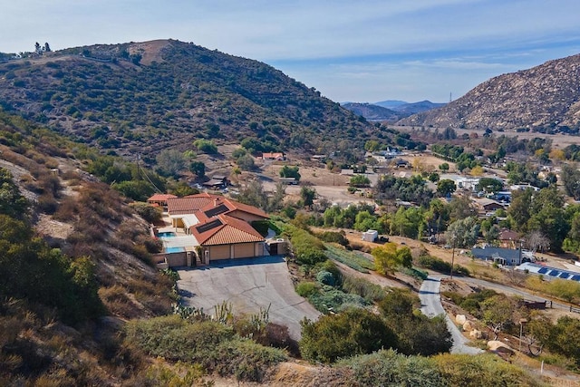 drone / aerial view featuring a mountain view