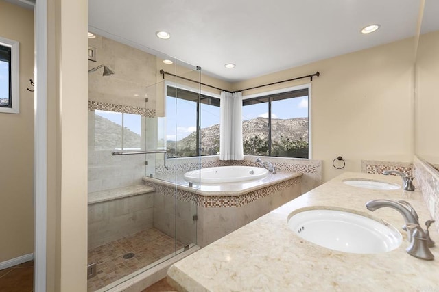 bathroom featuring separate shower and tub, tile patterned floors, a mountain view, and vanity