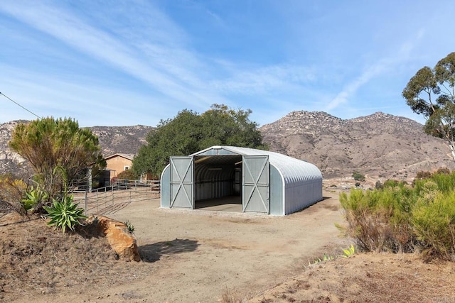 view of outdoor structure featuring a mountain view