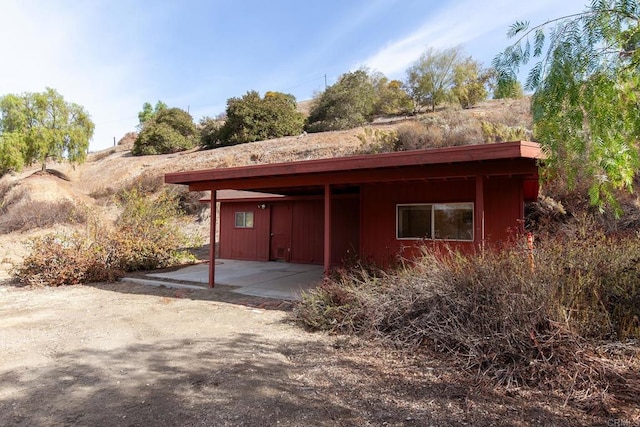 exterior space with a carport