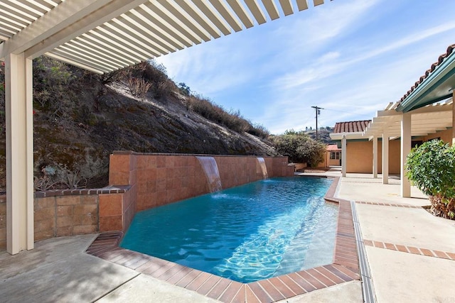 view of swimming pool with a pergola, a patio area, and pool water feature