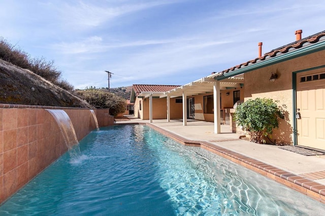 view of swimming pool with a patio and pool water feature