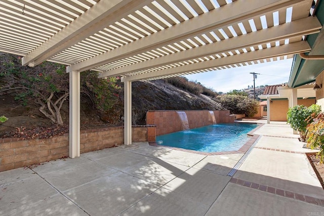 view of swimming pool with a patio, a pergola, and pool water feature