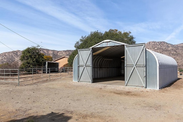 view of outdoor structure with a mountain view