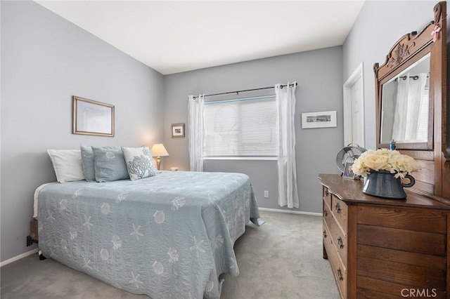 bedroom featuring light colored carpet