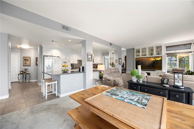 dining area with tile patterned flooring