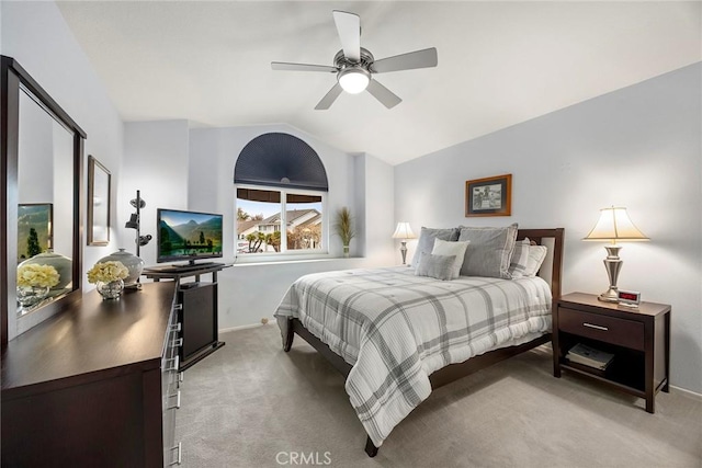 carpeted bedroom with ceiling fan and lofted ceiling