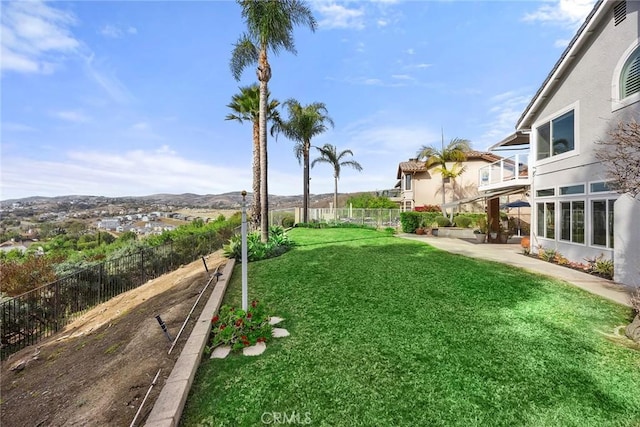 view of yard featuring a balcony