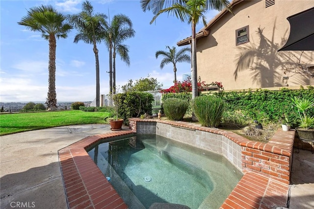 view of swimming pool with a yard and an in ground hot tub