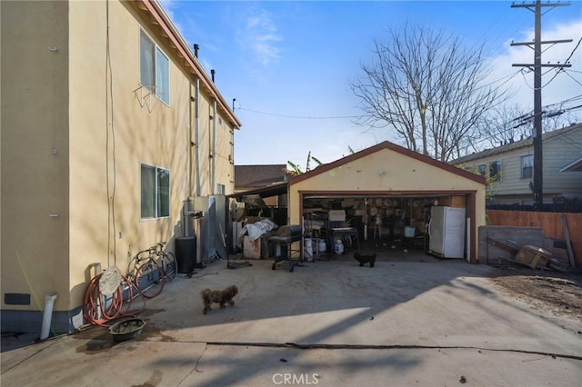 view of property exterior with an outbuilding and a garage