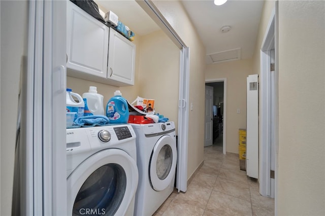 laundry area featuring independent washer and dryer and light tile patterned floors