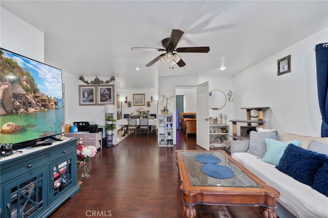 living room with dark hardwood / wood-style floors and ceiling fan