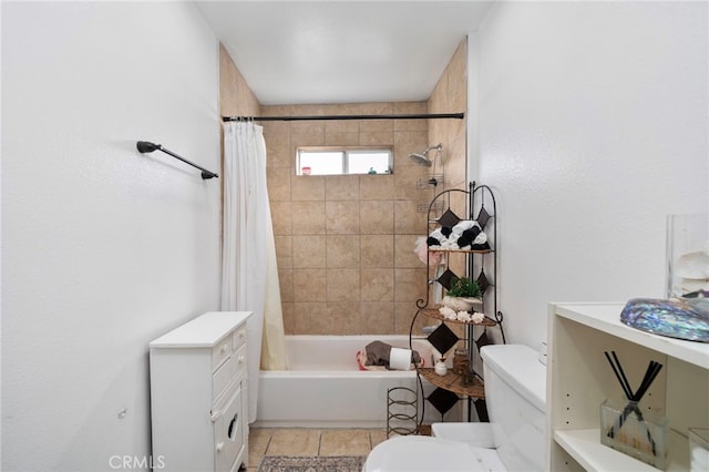 bathroom featuring shower / tub combo with curtain and toilet