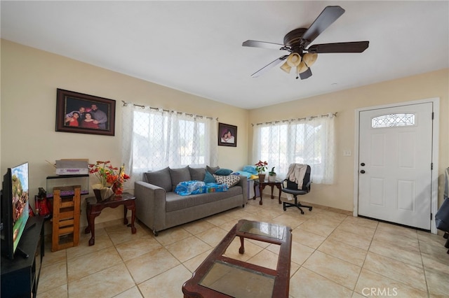 tiled living room featuring ceiling fan