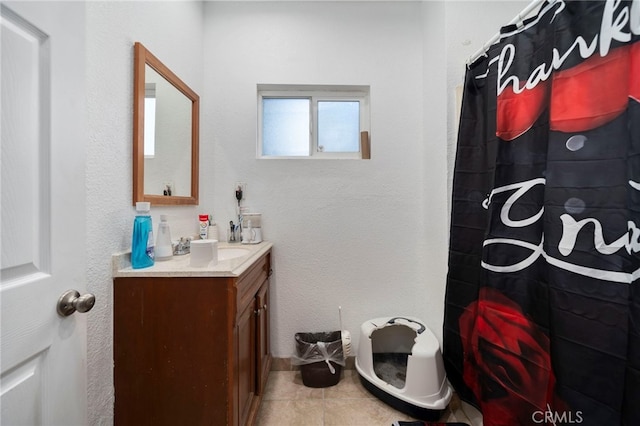 bathroom featuring vanity, tile patterned floors, and a shower with shower curtain