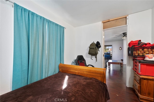 bedroom with dark hardwood / wood-style floors