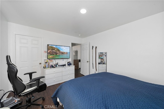 bedroom featuring dark hardwood / wood-style flooring