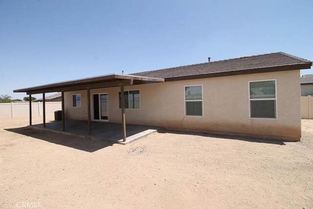 913 Wren Ct, Barstow, CA 92311 - rear view of property with a patio, stucco siding, and a tile roof