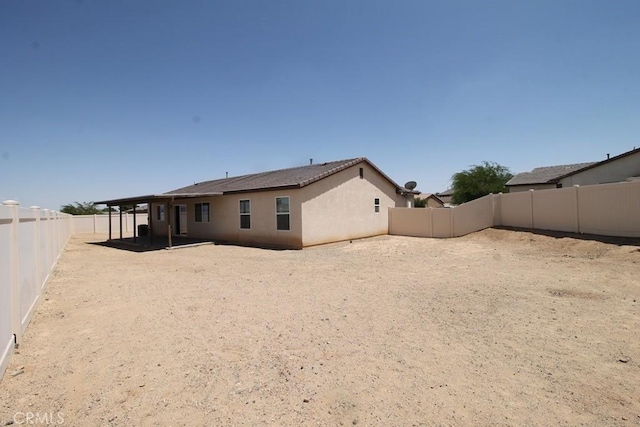 913 Wren Ct, Barstow, CA 92311 - back of property with a fenced backyard and stucco siding