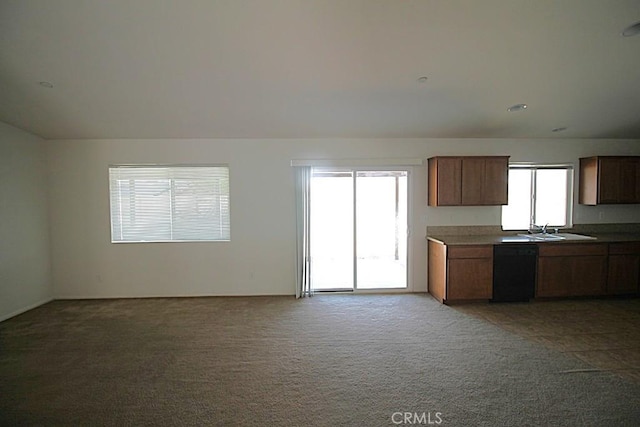 913 Wren Ct, Barstow, CA 92311 - kitchen with light carpet, a sink, open floor plan, and dishwasher