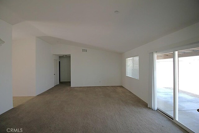 913 Wren Ct, Barstow, CA 92311 - carpeted spare room with vaulted ceiling