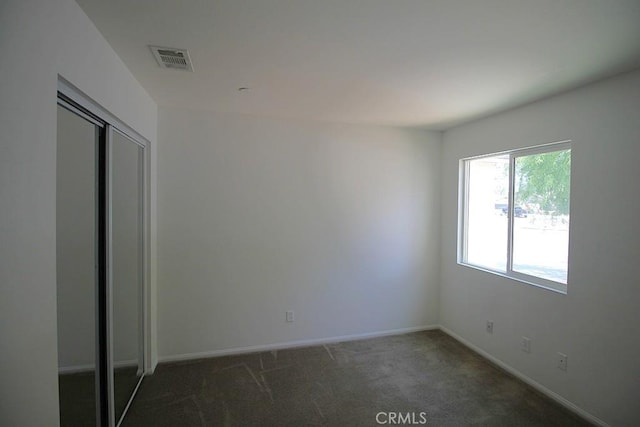 913 Wren Ct, Barstow, CA 92311 - unfurnished bedroom featuring carpet floors, baseboards, and a closet