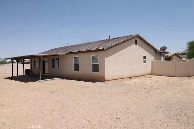 913 Wren Ct, Barstow, CA 92311 - back of house featuring a patio, stucco siding, and a tile roof