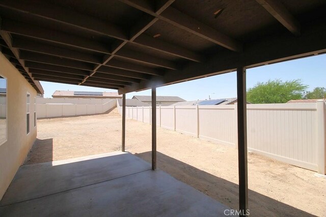 913 Wren Ct, Barstow, CA 92311 - fenced backyard with a patio area