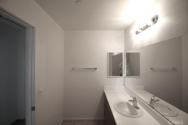 913 Wren Ct, Barstow, CA 92311 - bathroom with vanity and baseboards