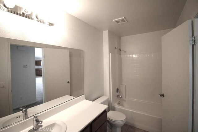 913 Wren Ct, Barstow, CA 92311 - bathroom featuring shower / bathtub combination, toilet, and vanity