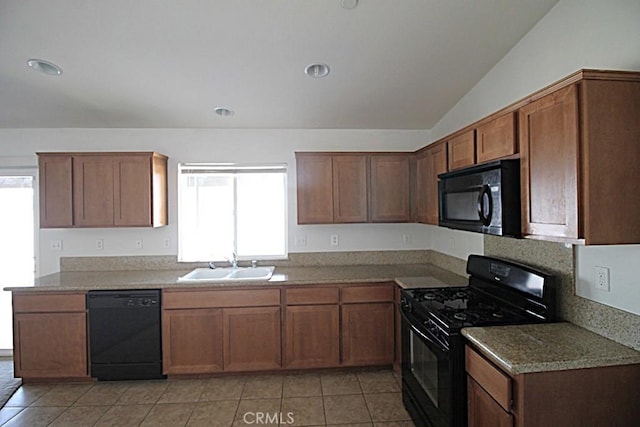 913 Wren Ct, Barstow, CA 92311 - kitchen featuring black appliances, a sink, light tile patterned floors, lofted ceiling, and brown cabinetry