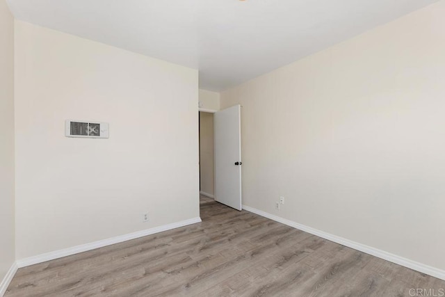 spare room featuring light hardwood / wood-style floors