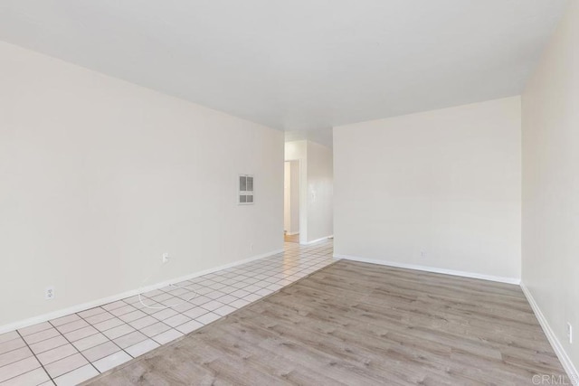 unfurnished room with light hardwood / wood-style flooring