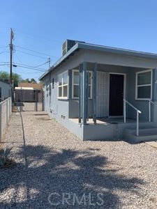 view of front of home featuring fence