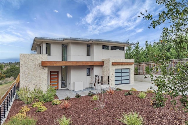 exterior space with a garage and a patio