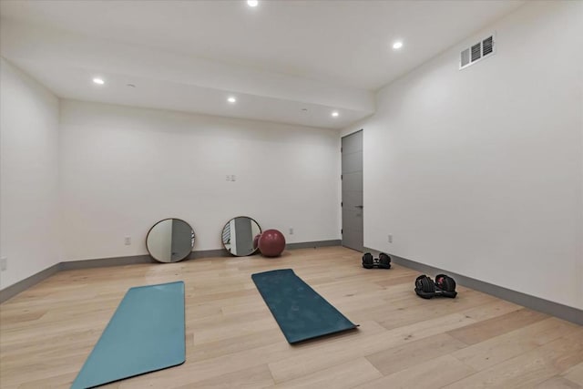 exercise area featuring light hardwood / wood-style flooring