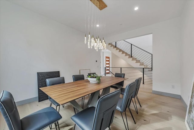 dining room featuring a chandelier and light hardwood / wood-style flooring