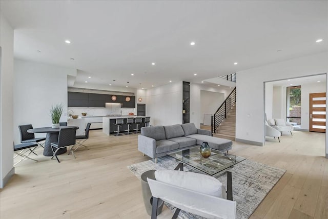 living room with light hardwood / wood-style flooring