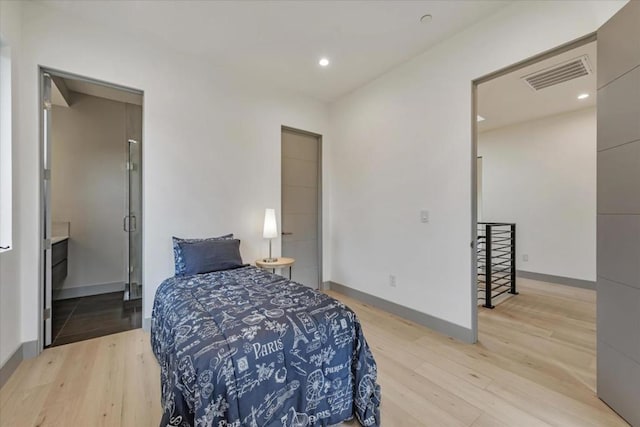 bedroom with light hardwood / wood-style flooring